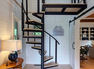 Spiral stair and landing in entry hall of the telegraph house.