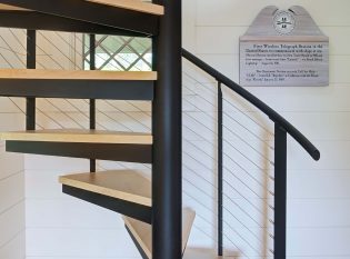 Spiral Stairs with custom railing posts and wire rope railings at the Telegraph House