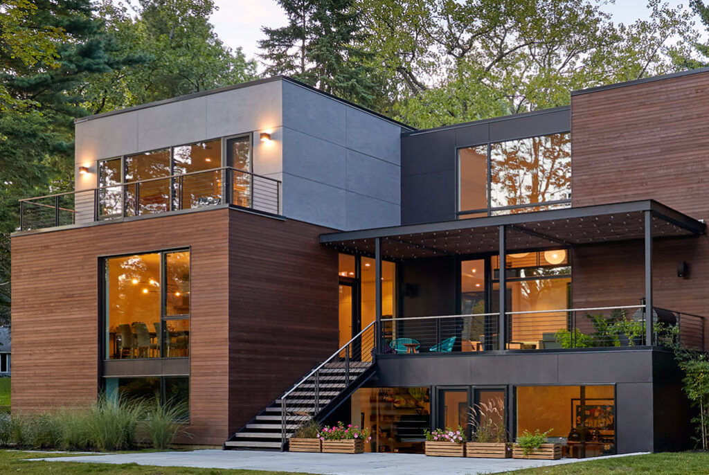 Modern Cube home with exterior floating stair and Pencil Railing