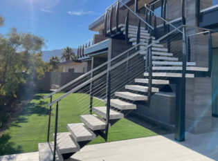 Exterior Floating Stair with Cable Railings and Travertine Treads