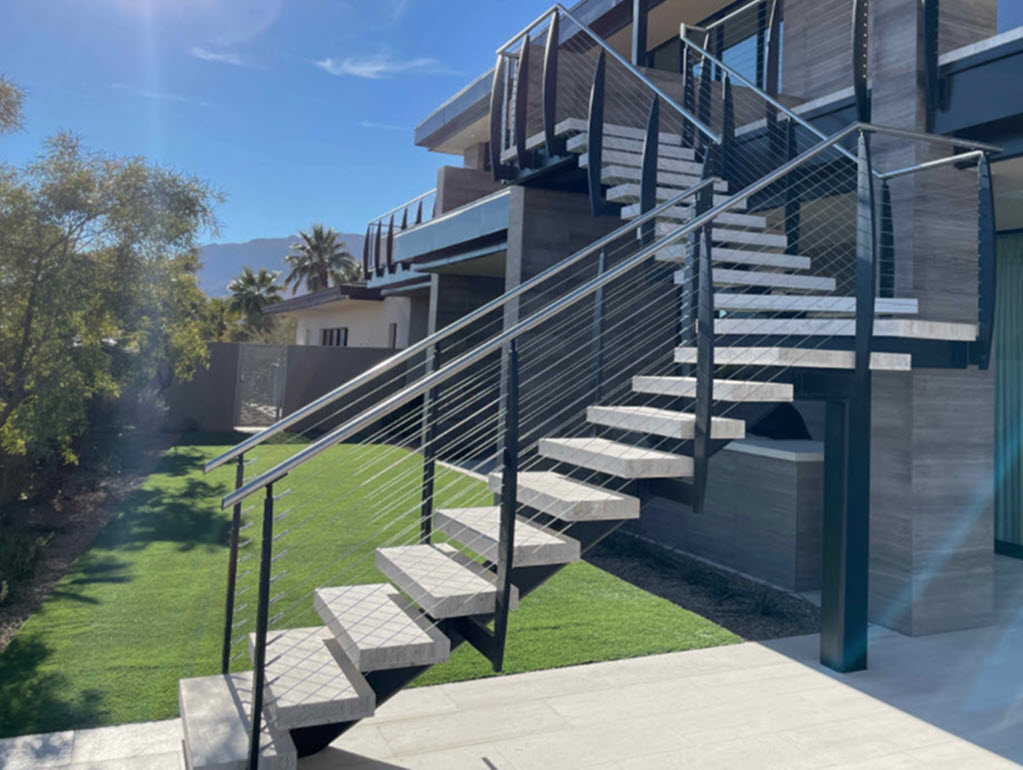 Exterior Floating Stair with Mono Stringer Cable Railings and Travertine steps