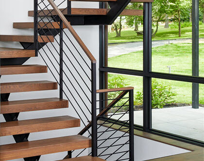 Horizontal Round Bar railing on floating stairs with wood treads