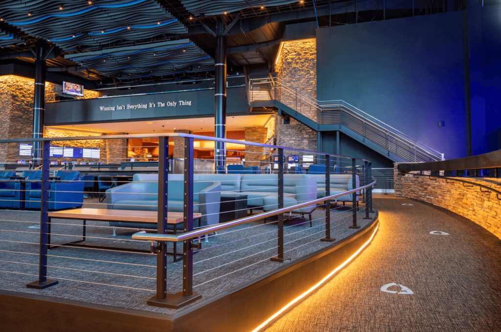 Interior Pedestrian ramp at casino sports betting facility with ADA handrails