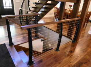 Entrance open staircase in center of home.