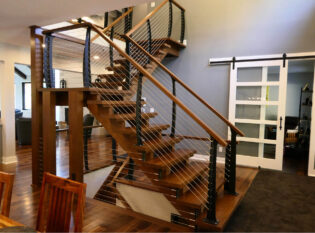 Custom cable railing connected to steps