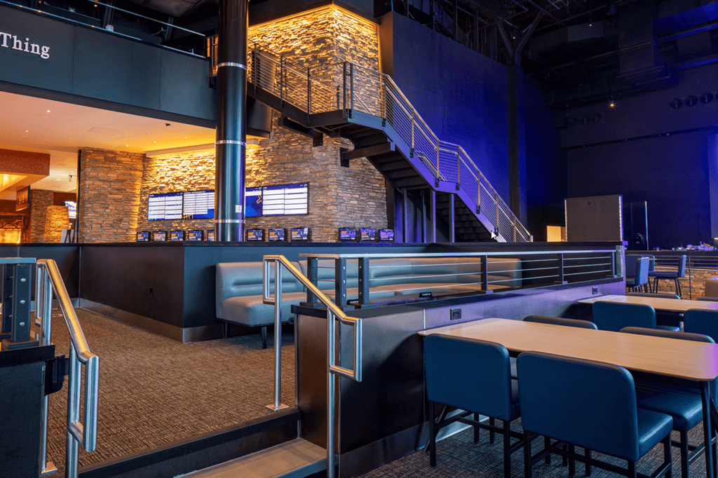 Cable Railing system on casino sportsbook theater viewing area and large staircase.