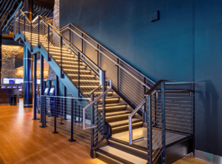 Monumental Stairs at casino with cable railings and slim railing posts.