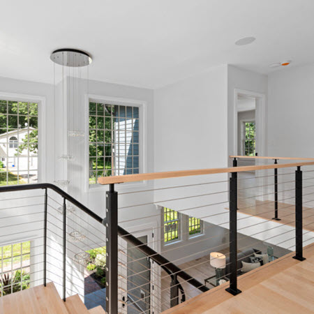 Balcony cable railings with wood top rail