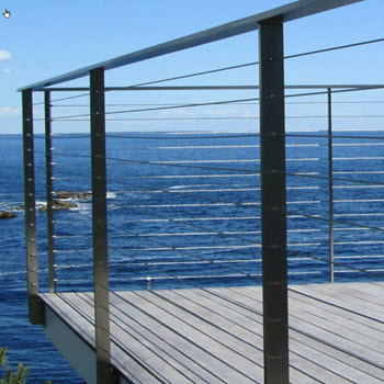 Stainless steel cable railing on deck overlooking the ocean