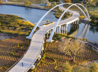 Curvy walkway bridge with massive architectural arches