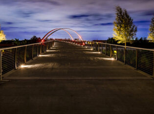 Night lighting of pedestrian walkway bridge Noisette Creek, SC