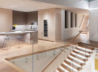 Double cantilever stairs with LED ligthing and glass railings