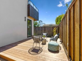 Private patio with view of upper level deck