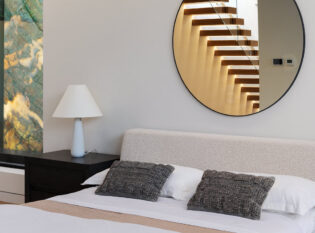 Bedroom Decor with stairs reflecting in mirror