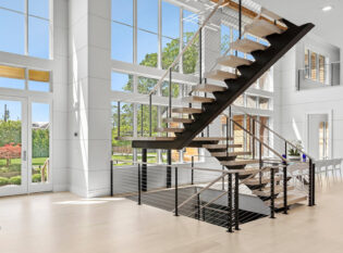 Floating steel single stringer staircase and landing