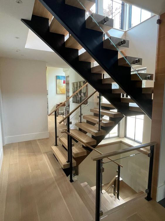 Double Stringer stair with hidden hardware and glass railing