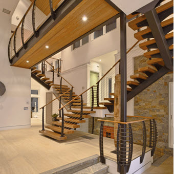 Floating stair with metal stair stringer and wood treads