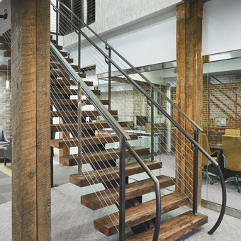 Rustic floating stair with ADA compliant handrails