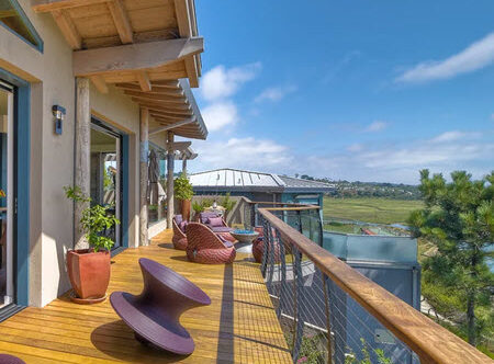 Curved Cable Railing on modern home deck by the ocean