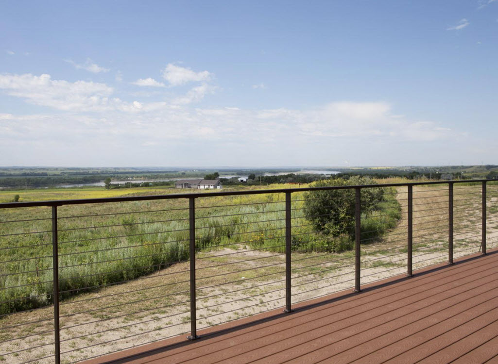 Observation deck at the National Lewis and Clark center. The deck overlooks a vast landscape and lake with our Ithaca cable railings that have slim posts.