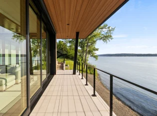 Cable railing system with black metal posts and top rail