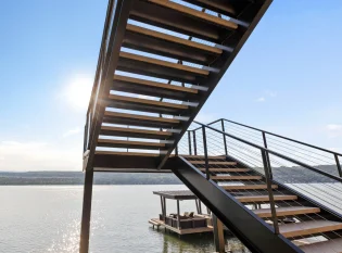 Exterior c-channel double stringer stairs with cable railings 