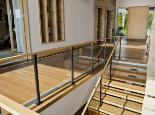 Custom floating staircase with glass railings and Metal Post