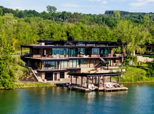 Modern luxury lake house with cable railings and Floating Stairs