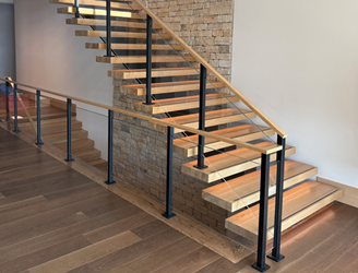 Slotted post glass railing designed to minimize the appearance of glass hardware and maintair a clean minimal aesthetic. The floating stairs have wood treads, LED lightings and slip resistant strips on the treads. 