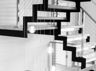 Modern Staircase combines stainless steel and oak