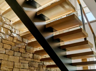 LED lighted stair treads on a mono stringer floating staircase