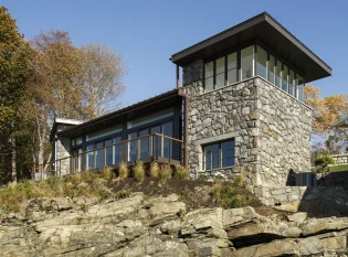 Stone house with Keuka railing