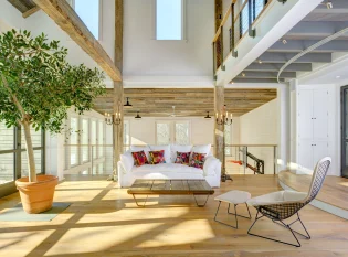 Balcony railing overlooks basketball court and stage