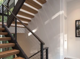 Cable railing system on wood stringer