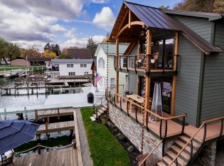 Exterior stairs and decks with curved fascia mounted cable railings
