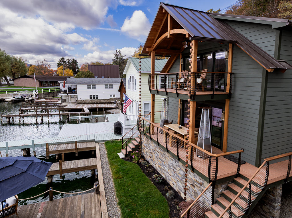 Exterior stairs and decks with curved fascia mounted cable railings
