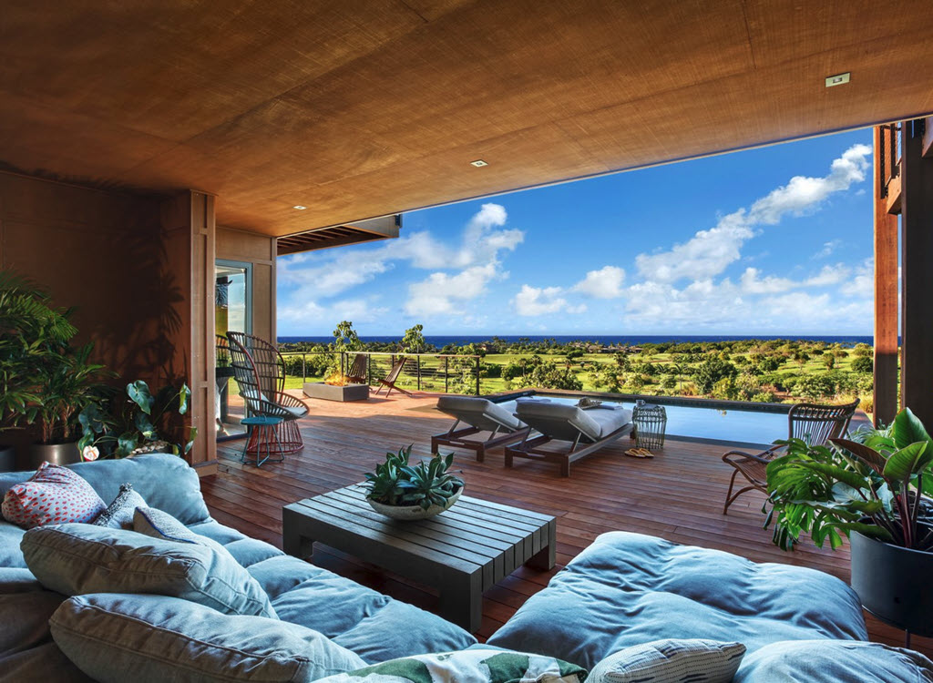 Infinity edge pool and Ithaca cable railings from the open concept living area with ocean views.